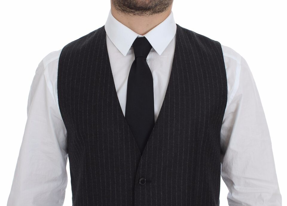 Gray striped wool Dolce & Gabbana logo vest gilet with front buttons and ribbed edges, stylish layered winter accessory.