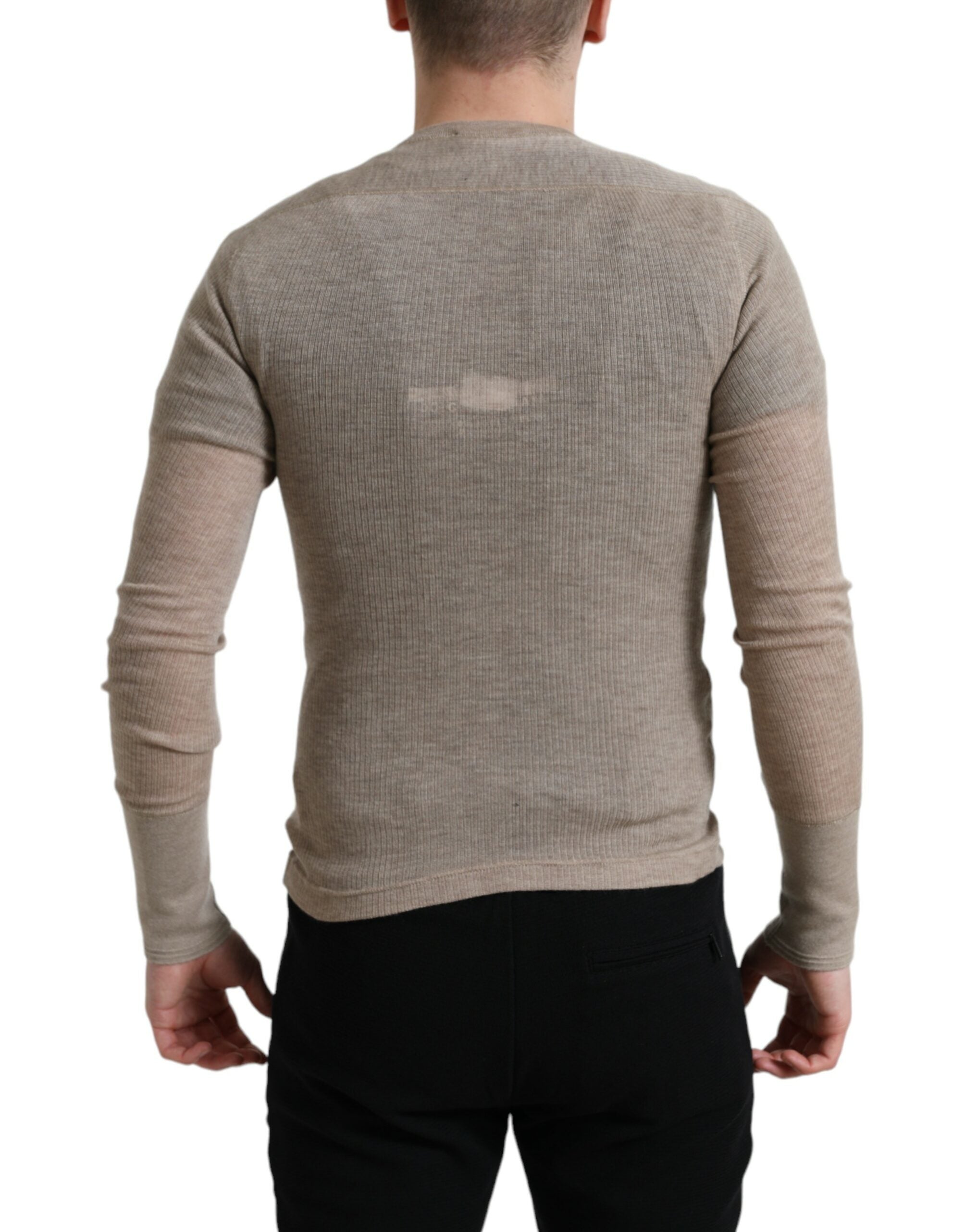 Beige cashmere Henley pullover sweater by Dolce & Gabbana, showing its soft knit fabric and classic buttoned neckline.