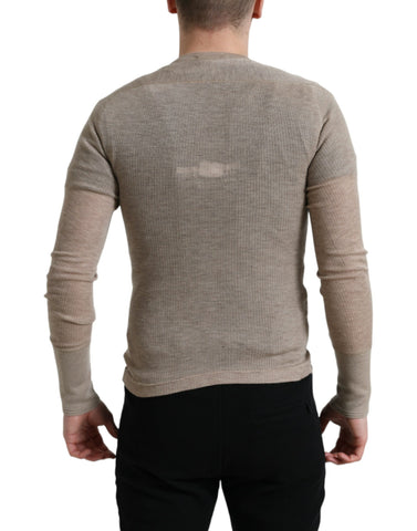 Beige cashmere Henley pullover sweater by Dolce & Gabbana, showing its soft knit fabric and classic buttoned neckline.