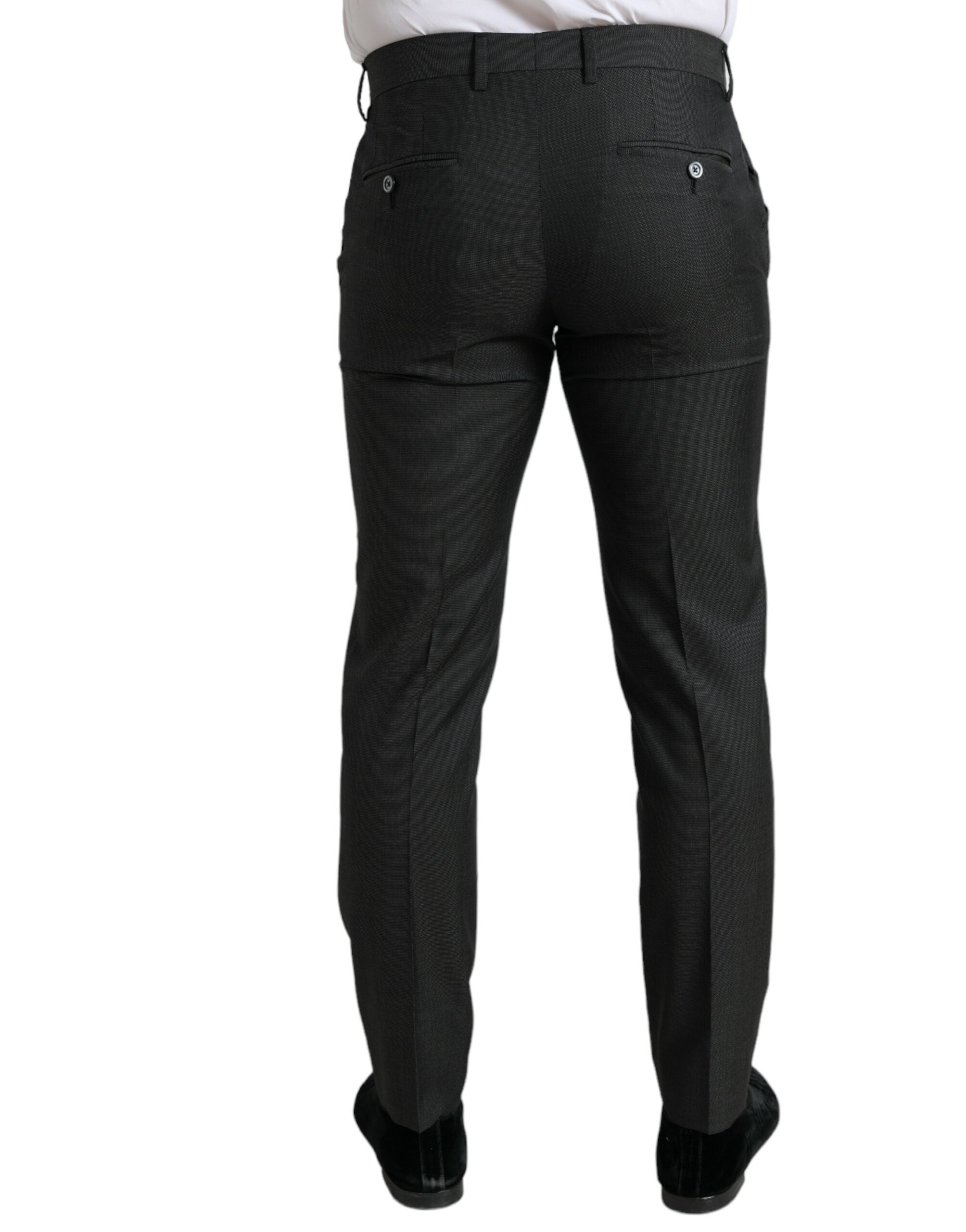 Dark gray Dolce & Gabbana stretch slim formal pants displayed on a hanger, showcasing tailored fit and sleek fabric.