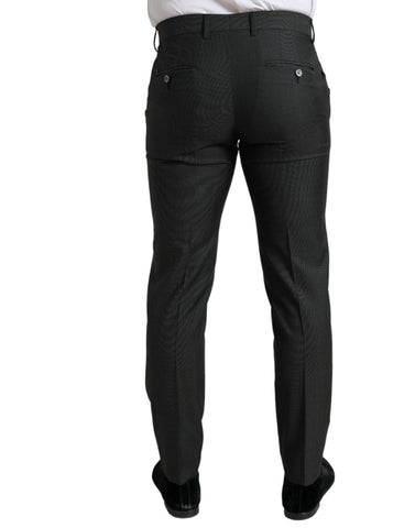Dark gray Dolce & Gabbana stretch slim formal pants displayed on a hanger, showcasing tailored fit and sleek fabric.