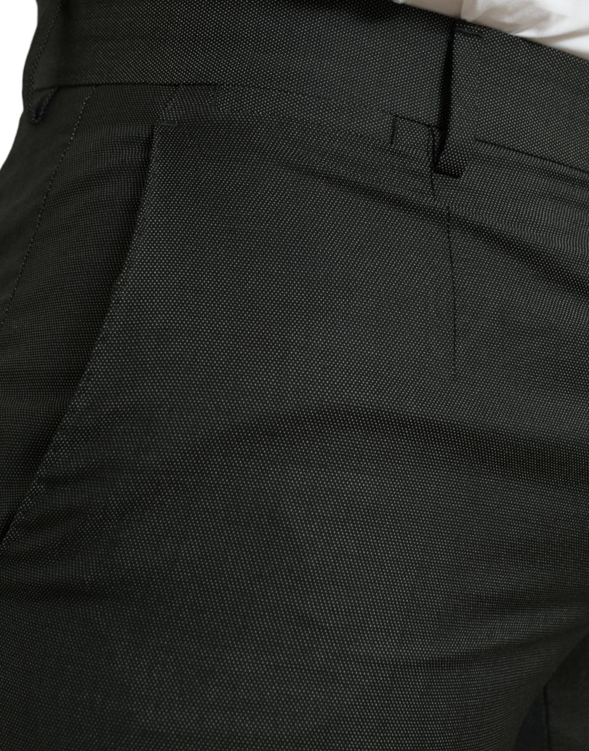 Dark gray Dolce & Gabbana stretch slim formal pants displayed on a hanger, showcasing tailored design and smooth fabric.