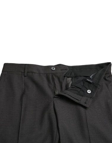 Dark gray stretch slim formal pants by Dolce & Gabbana displayed on a hanger with a clean background.