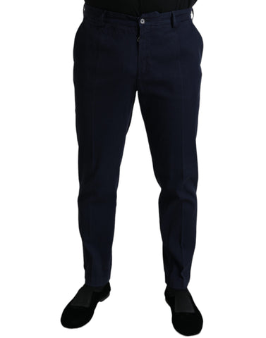 Dark blue cotton stretch slim fit dress pants by Dolce & Gabbana displayed on a hanger.