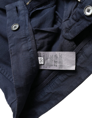 Dark blue cotton stretch slim fit dress pants by Dolce & Gabbana, shown on a hanger with a tailored, sleek appearance.