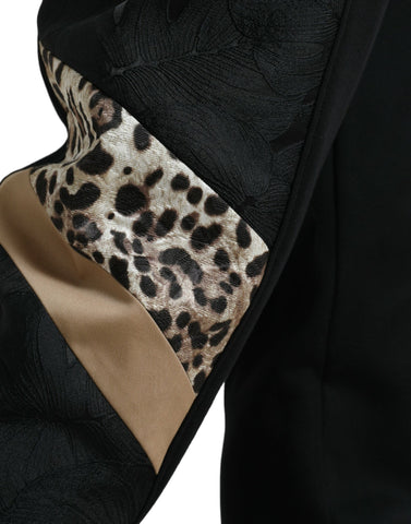 Black cotton slim stretch jogger pants by Dolce & Gabbana, shown with elastic waistband and tapered fit.