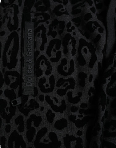 Black leopard print cotton slim fit jogger pants by Dolce & Gabbana, showing the stylish design and fit.