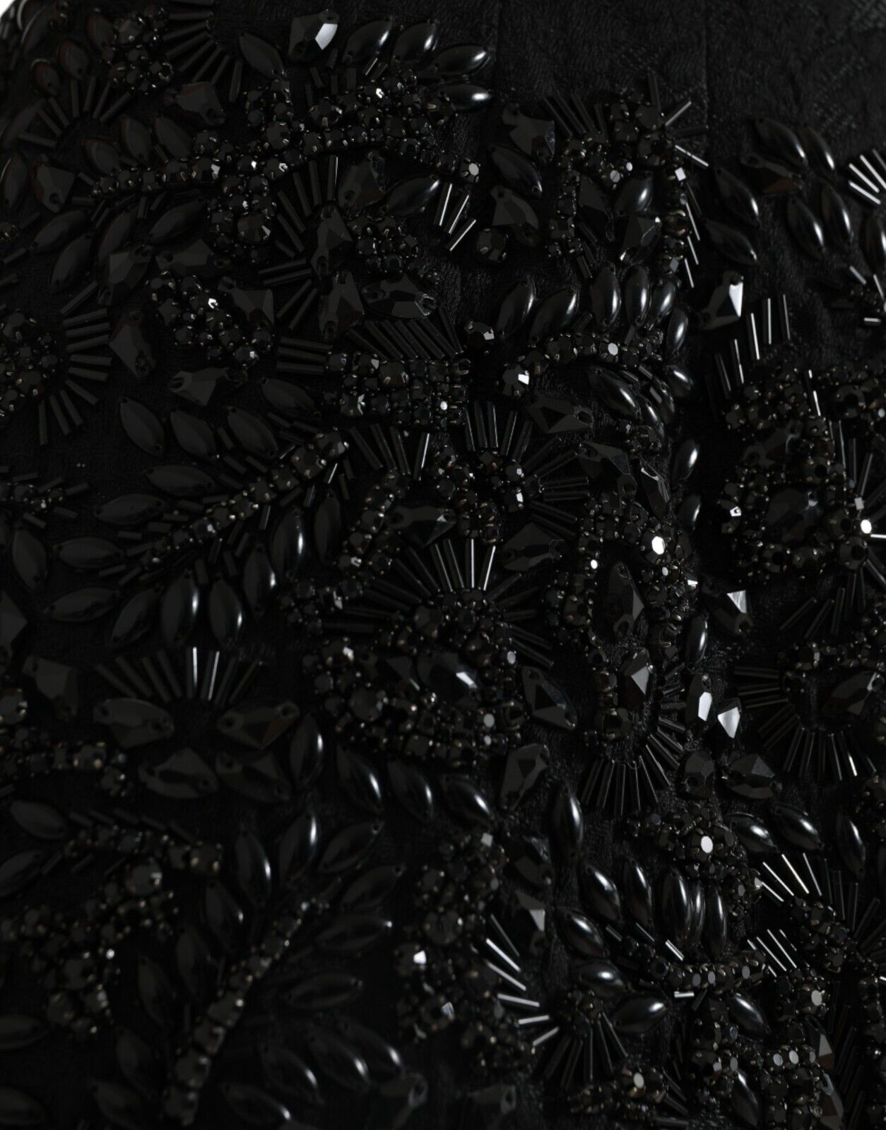 Black crystal-embellished handmade knee-length pencil skirt by Dolce & Gabbana, featuring a fitted silhouette and elegant design.