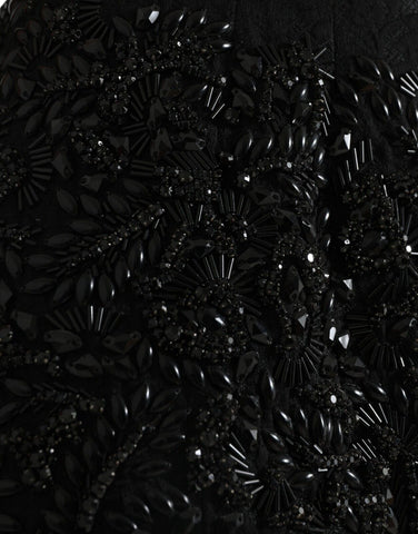 Black crystal-embellished handmade knee-length pencil skirt by Dolce & Gabbana, featuring a fitted silhouette and elegant design.