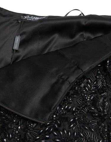 Black crystal-embellished handmade knee-length pencil skirt by Dolce & Gabbana, featuring a fitted silhouette and elegant design.