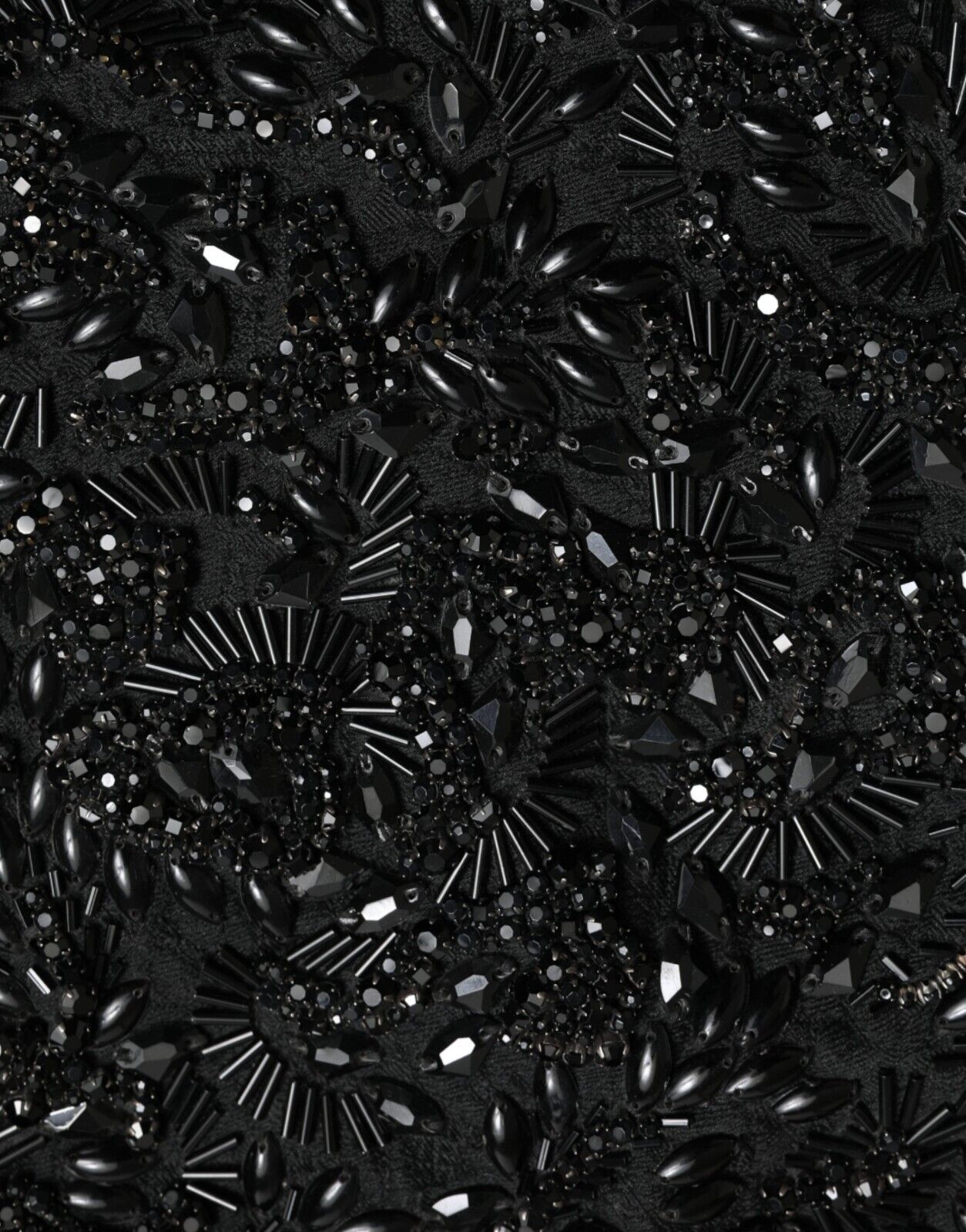 Black crystal handmade knee-length pencil skirt by Dolce & Gabbana, featuring intricate crystal embellishments and a fitted silhouette.
