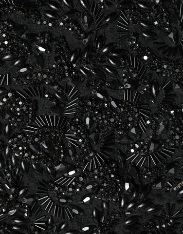 Black crystal handmade knee-length pencil skirt by Dolce & Gabbana, featuring intricate crystal embellishments and a fitted silhouette.