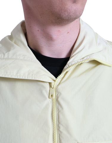 Yellow nylon collared full zip parka jacket by Dolce & Gabbana displayed on a hanger.