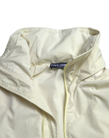 Yellow nylon collared full zip parka jacket by Dolce & Gabbana with front zipper and hood, shown on a plain background.