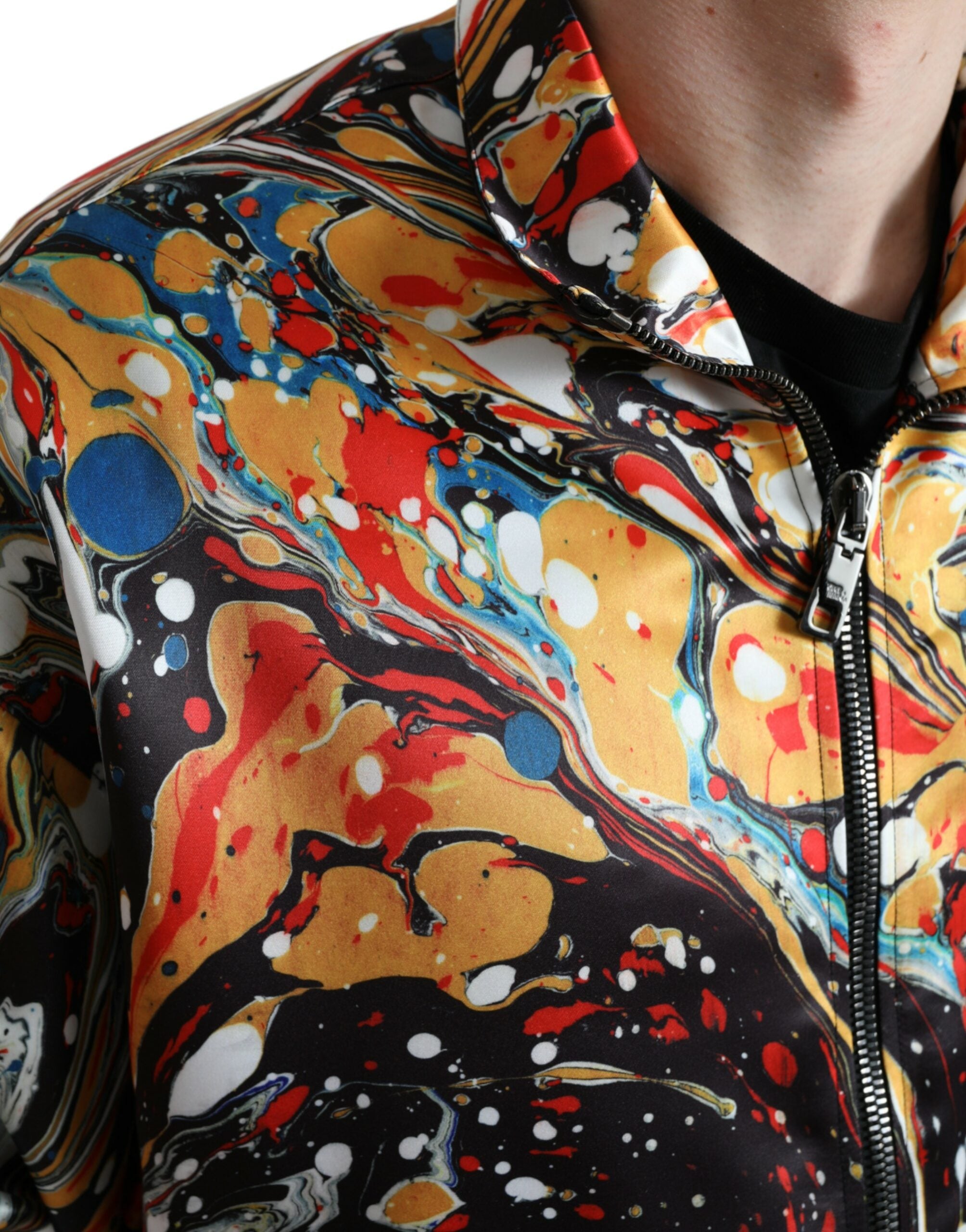 Multicolor abstract polyester bomber jacket by Dolce & Gabbana, featuring vibrant patterns and a classic bomber silhouette.