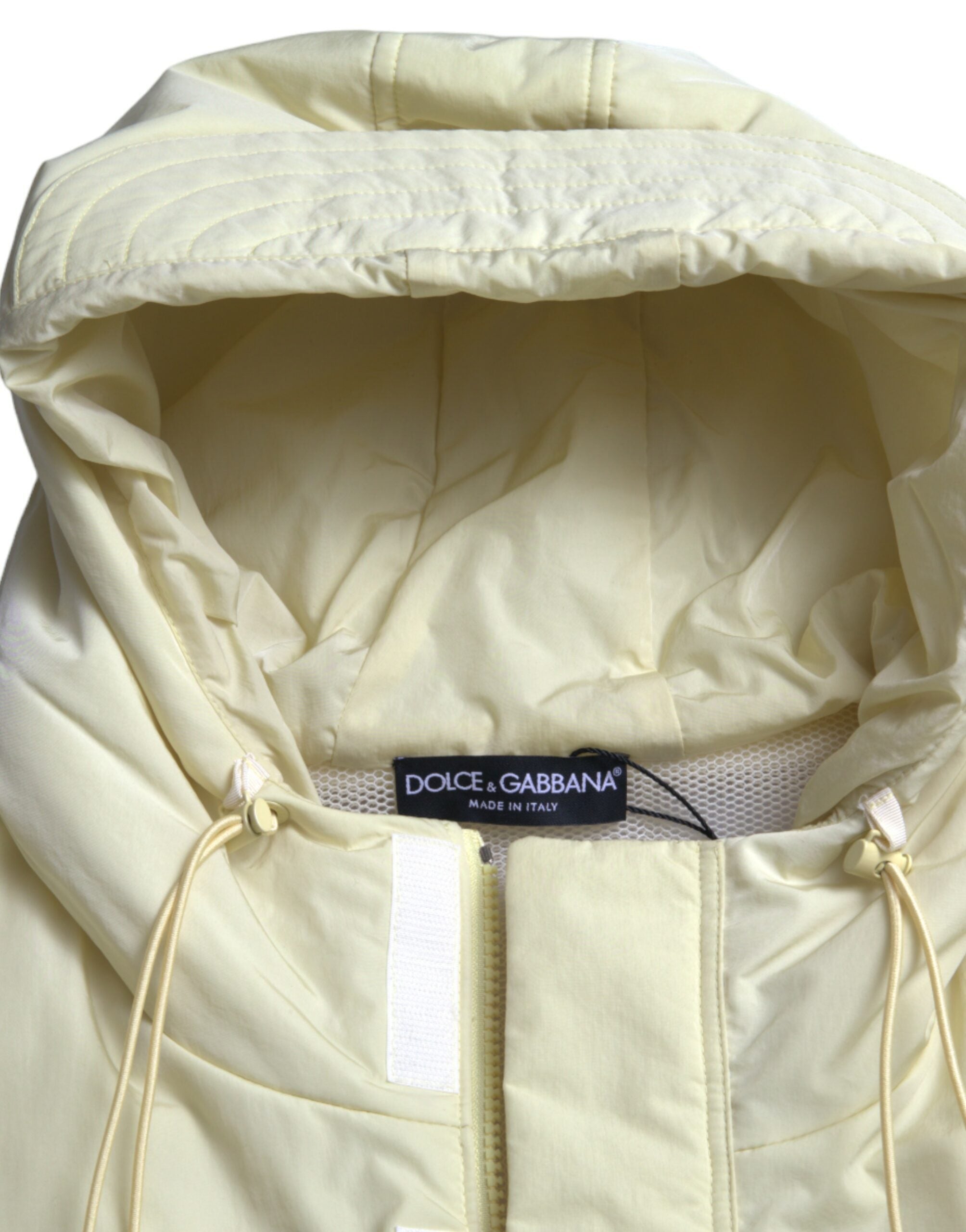Yellow nylon hooded sportswear vest jacket by Dolce & Gabbana, featuring a lightweight design and hood, shown on a mannequin.