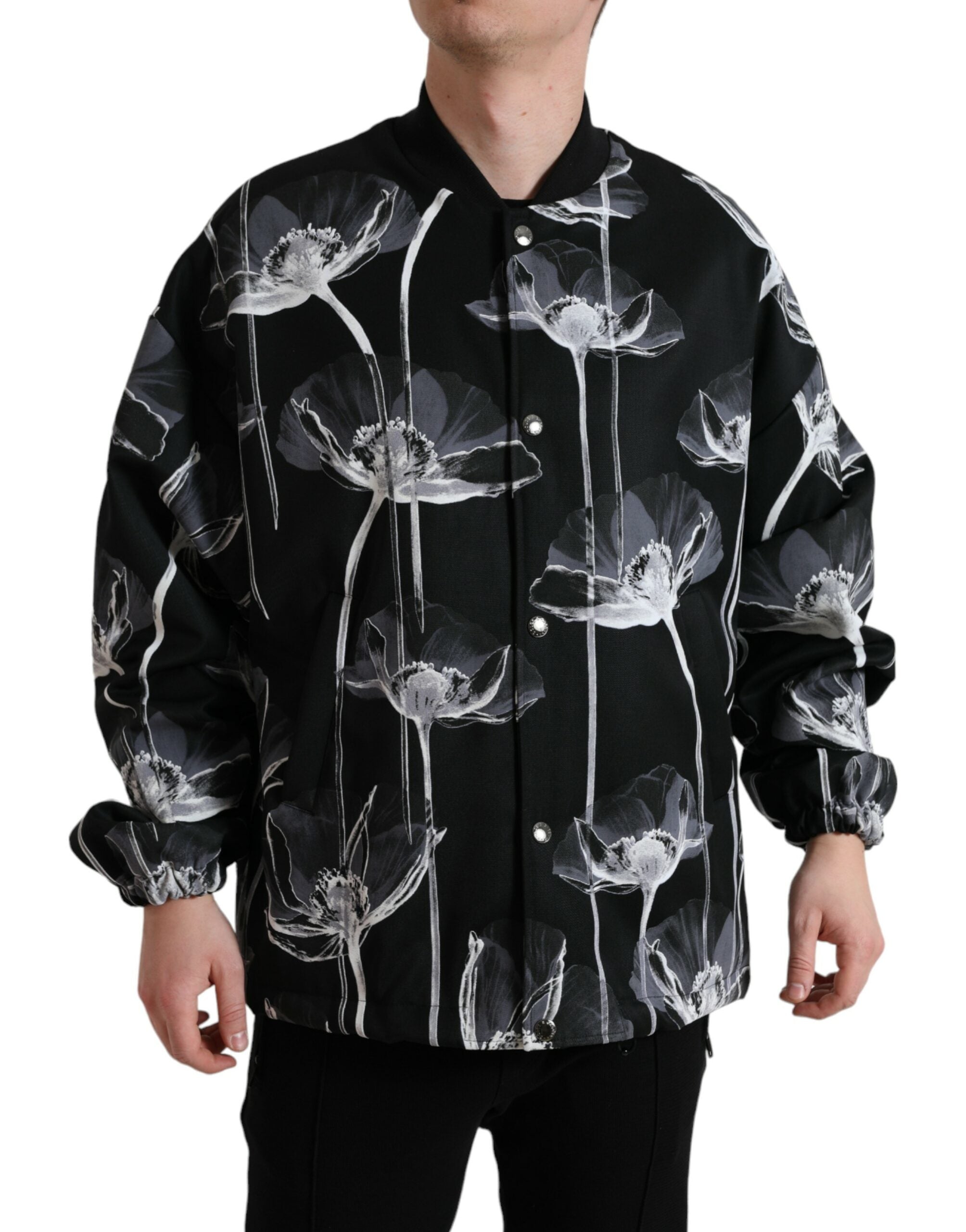 Dolce & Gabbana black floral print wool button-down bomber jacket displayed on a hanger.