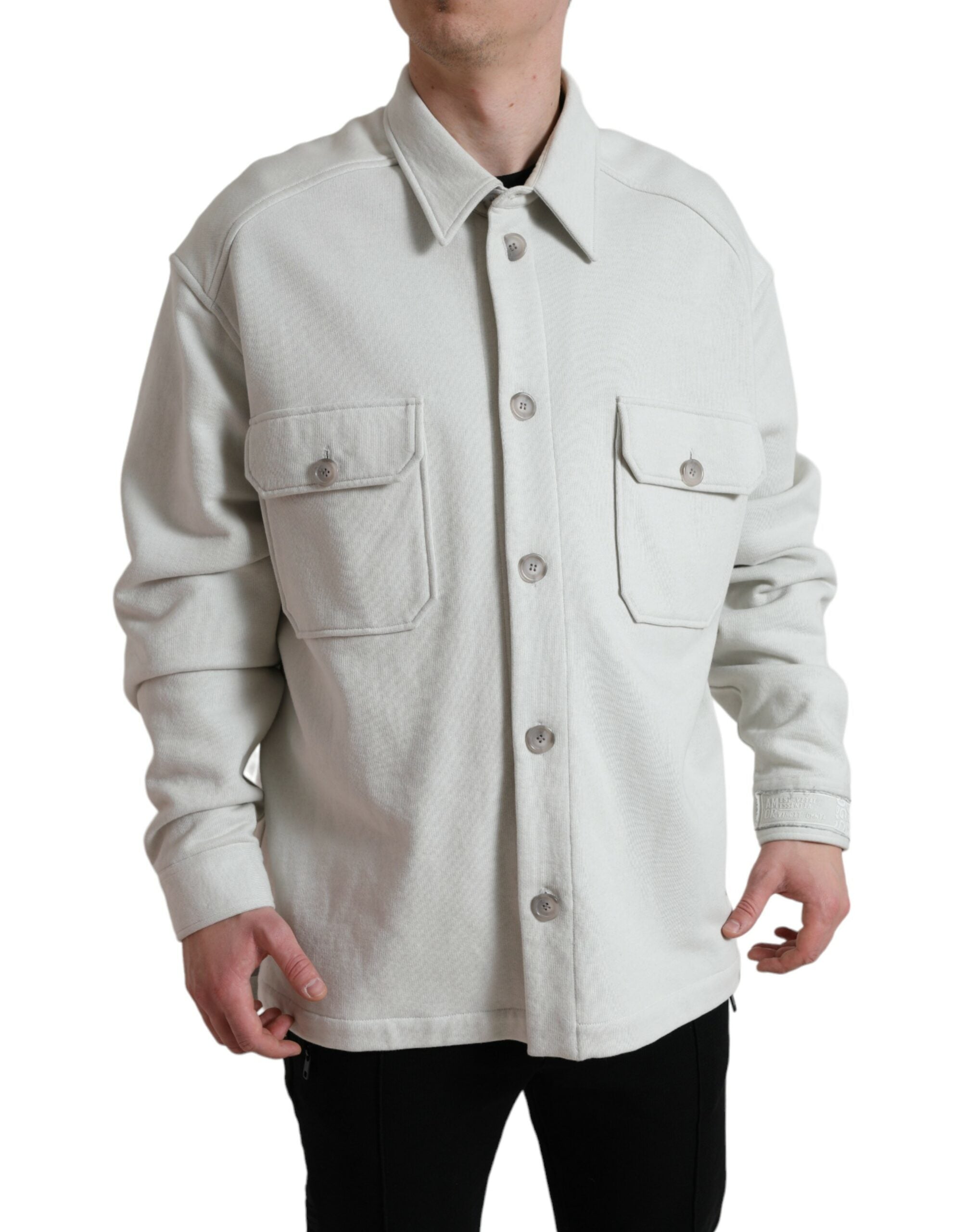 Grey cotton button-down collared coat jacket by Dolce & Gabbana displayed on a hanger.