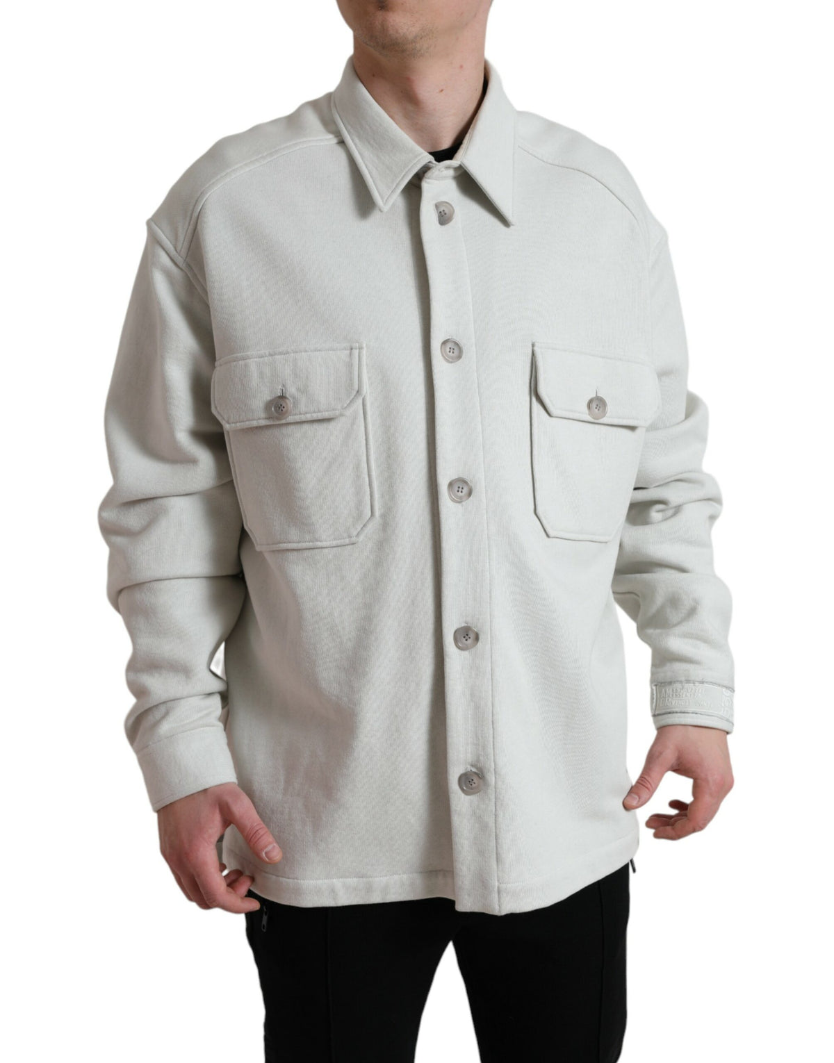 Grey cotton button-down collared coat jacket by Dolce & Gabbana displayed on a hanger.