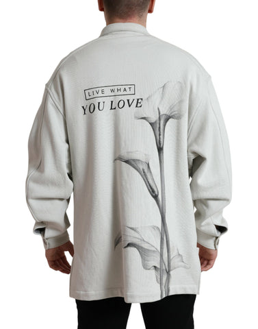Grey cotton button-down collared coat jacket by Dolce & Gabbana, shown hanging with front view and details visible.