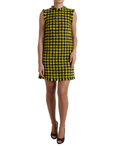 Yellow houndstooth sleeveless A-line mini dress by Dolce & Gabbana, featuring a fitted bodice and classic pattern.
