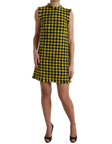 Yellow houndstooth sleeveless A-line mini dress by Dolce & Gabbana, featuring a fitted bodice and classic pattern.