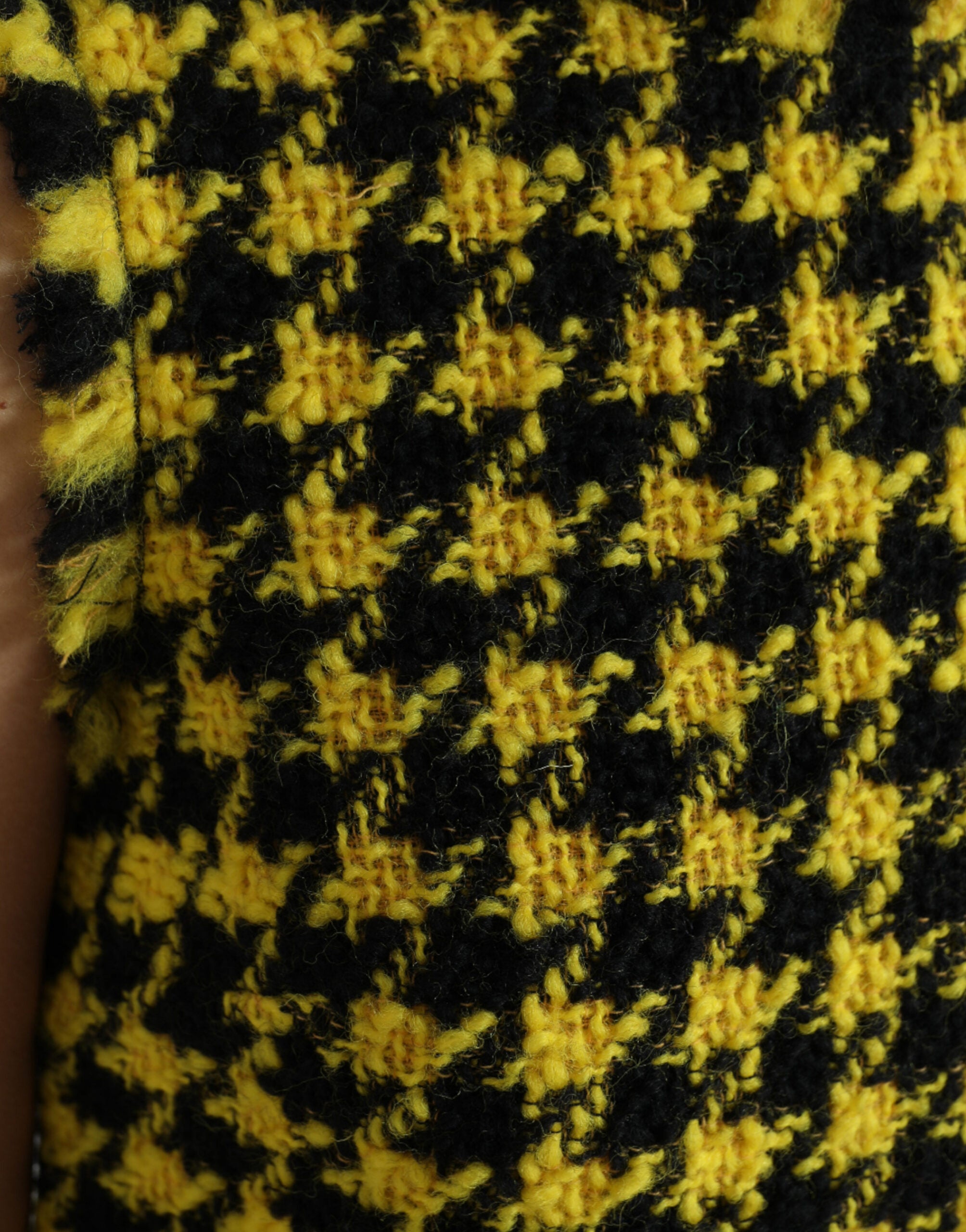 Yellow houndstooth sleeveless A-line mini dress by Dolce & Gabbana, featuring a fitted bodice and flared skirt.