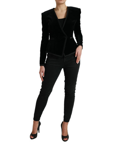 Black velvet cotton double-breasted jacket by Dolce & Gabbana, shown on a hanger with detailed lapels and button closure.