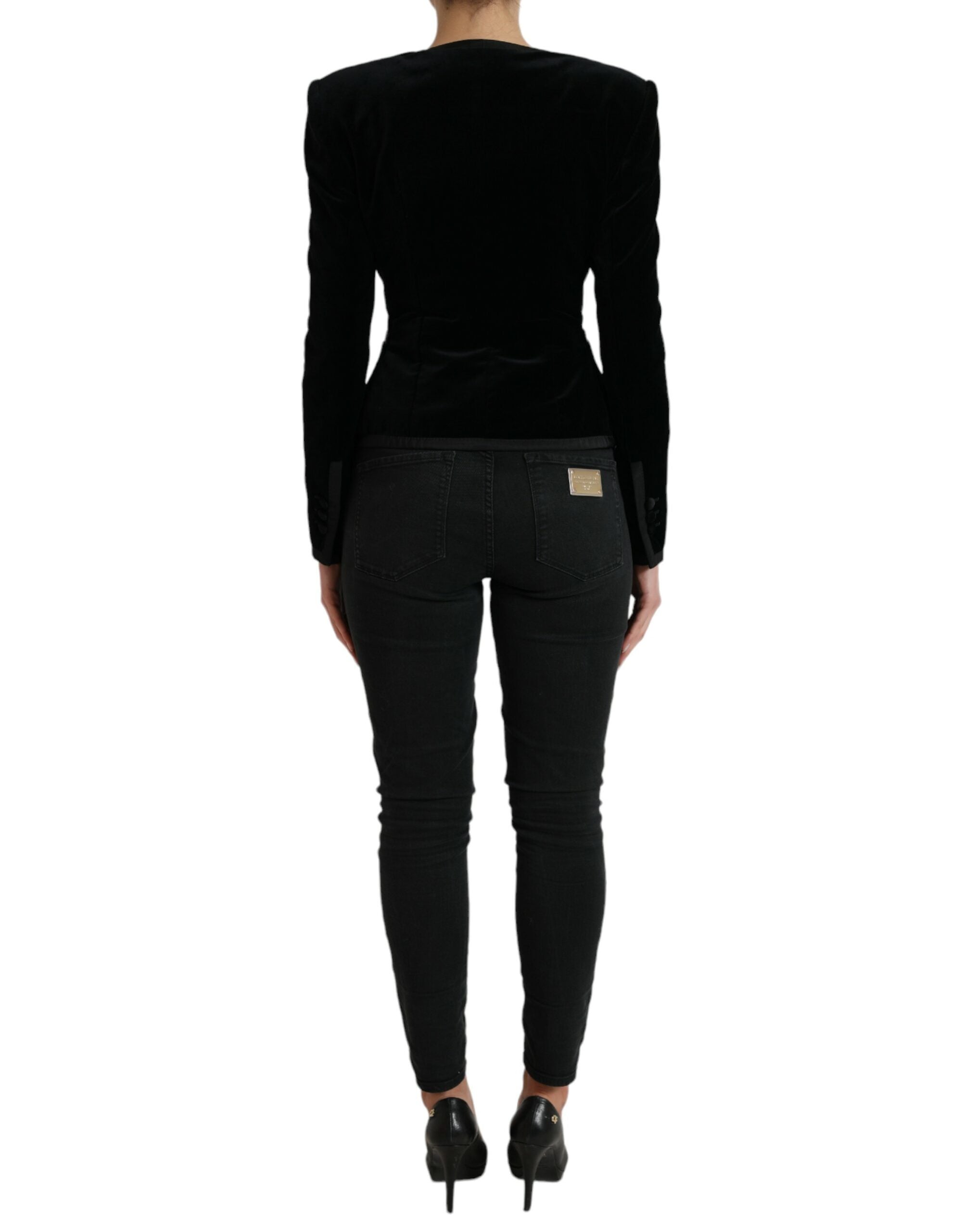 Black velvet cotton double-breasted jacket by Dolce & Gabbana, shown with front view and button details.