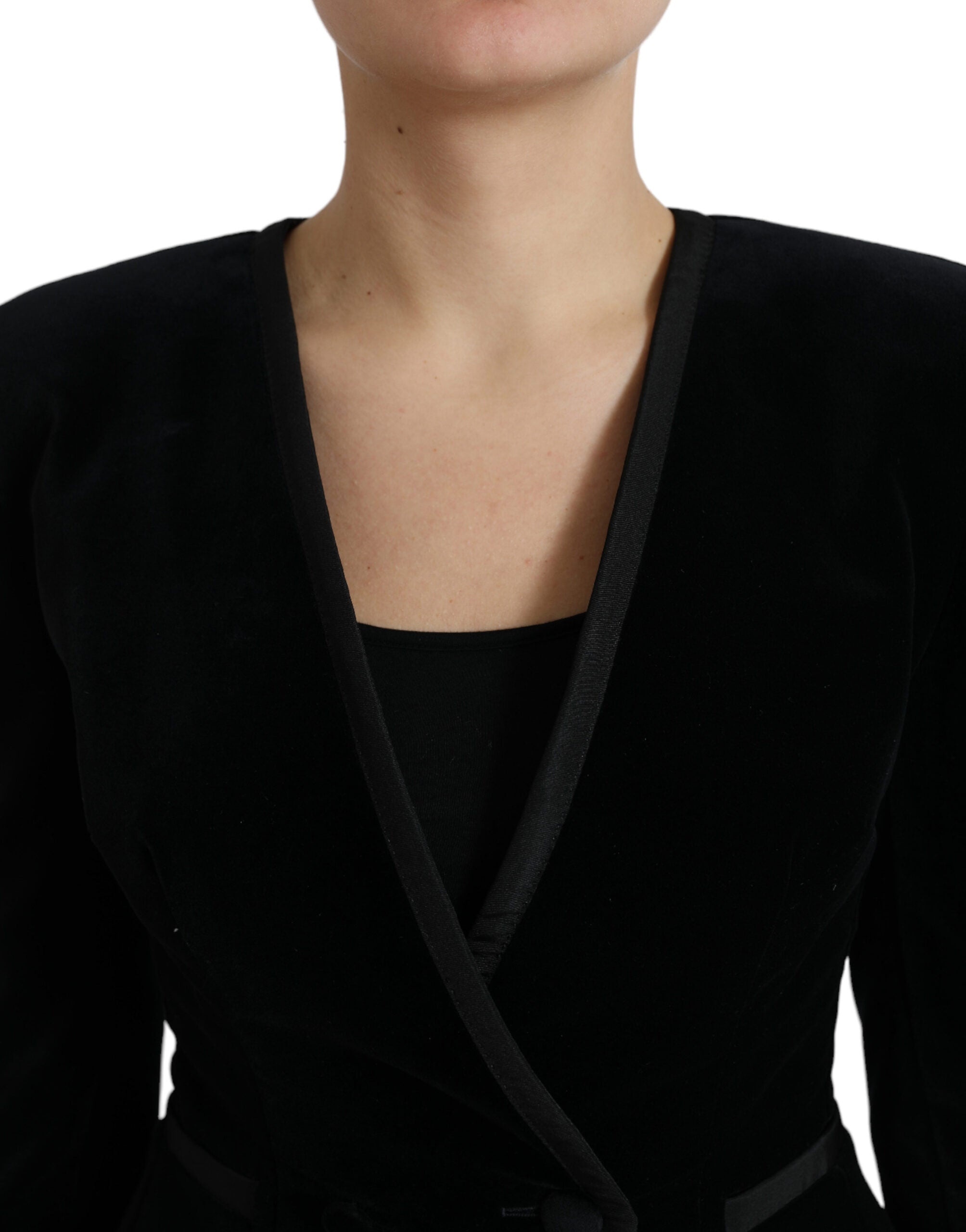 Black velvet cotton double-breasted jacket by Dolce & Gabbana, shown on a hanger with detailed fabric texture and classic design.