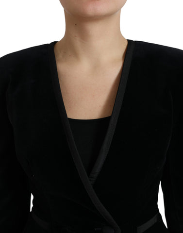 Black velvet cotton double-breasted jacket by Dolce & Gabbana, shown on a hanger with detailed fabric texture and classic design.