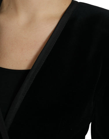 Black velvet cotton double-breasted jacket by Dolce & Gabbana, displayed on a hanger with detailed fabric texture.