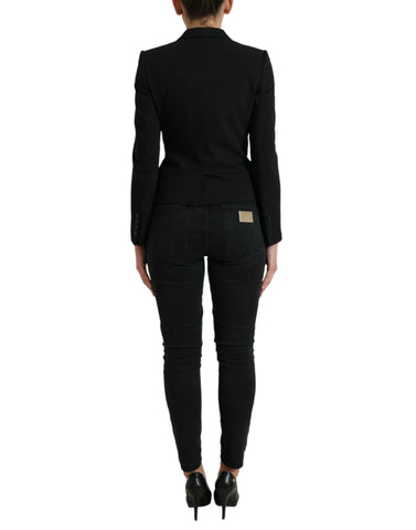 Black wool single-breasted blazer coat by Dolce & Gabbana, featuring classic lapels and tailored fit, shown on a hanger.