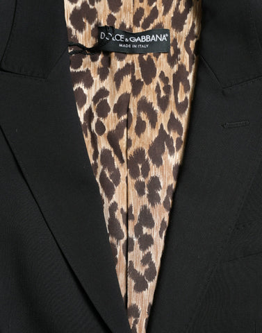 Black wool Dolce & Gabbana single-breasted blazer coat with notch lapels and tailored fit, displayed on a hanger.