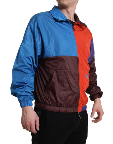 Multicolor Dolce & Gabbana windbreaker jacket with vibrant color blocks and lightweight material, suitable for casual outdoor wear.
