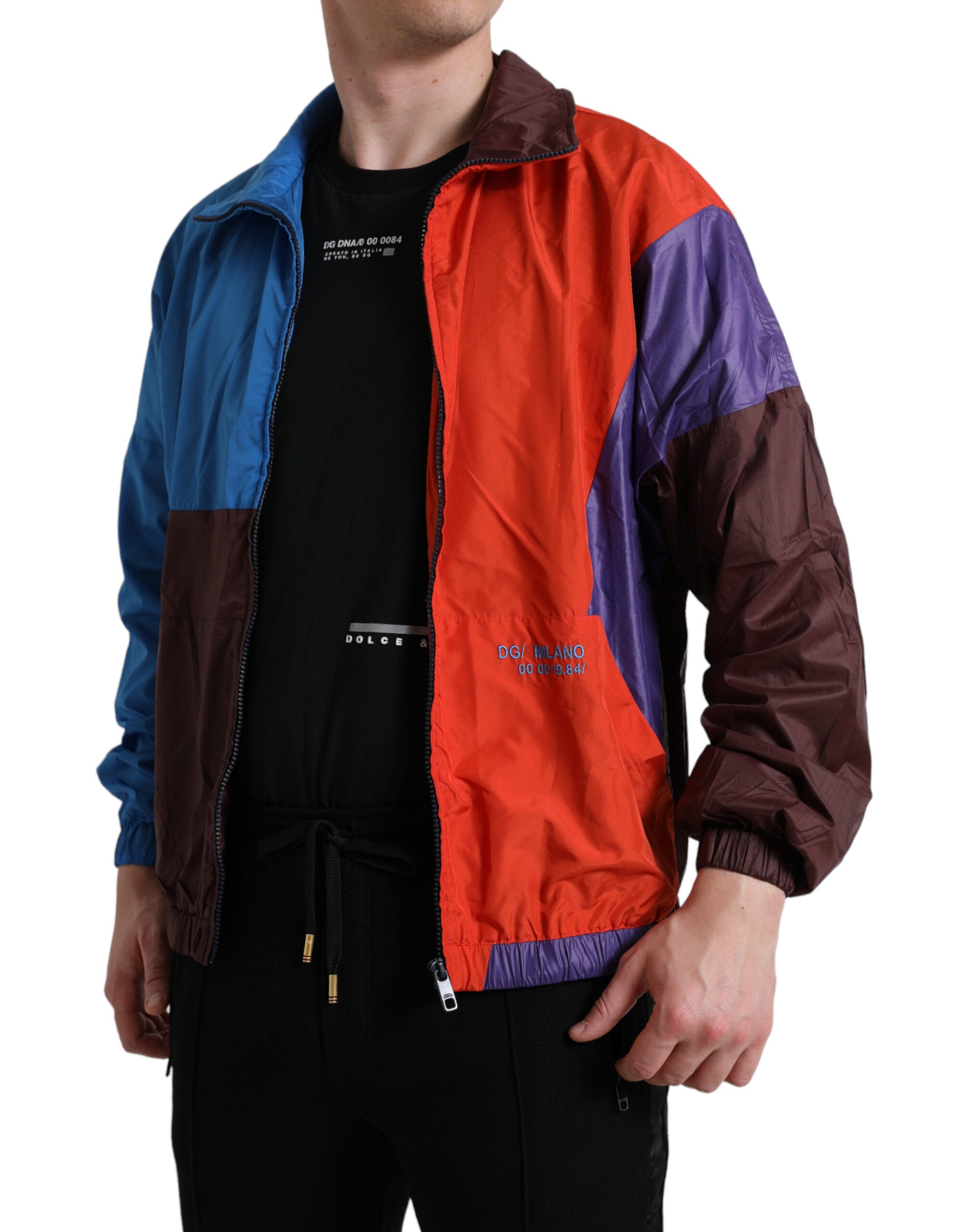 Multicolor Dolce & Gabbana windbreaker jacket with vibrant color blocks and lightweight fabric, shown on a model.