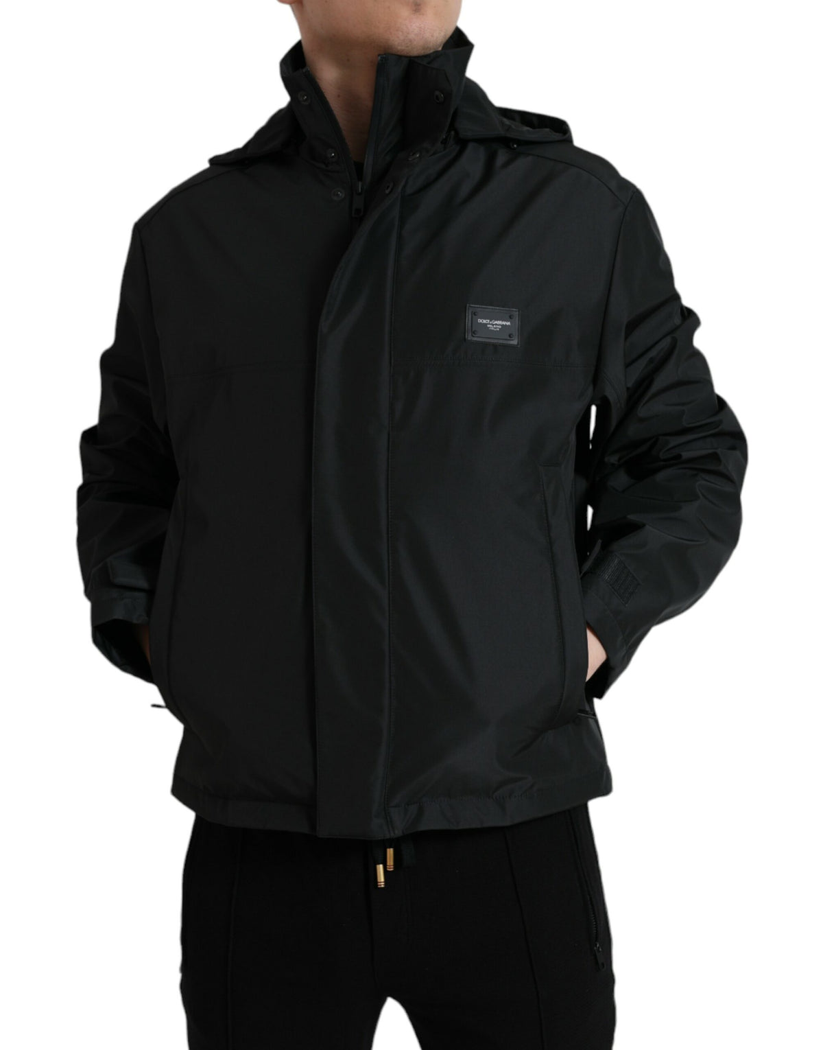 Black polyester hooded jacket with a logo plaque from Dolce & Gabbana, featuring a front zipper and casual fit.