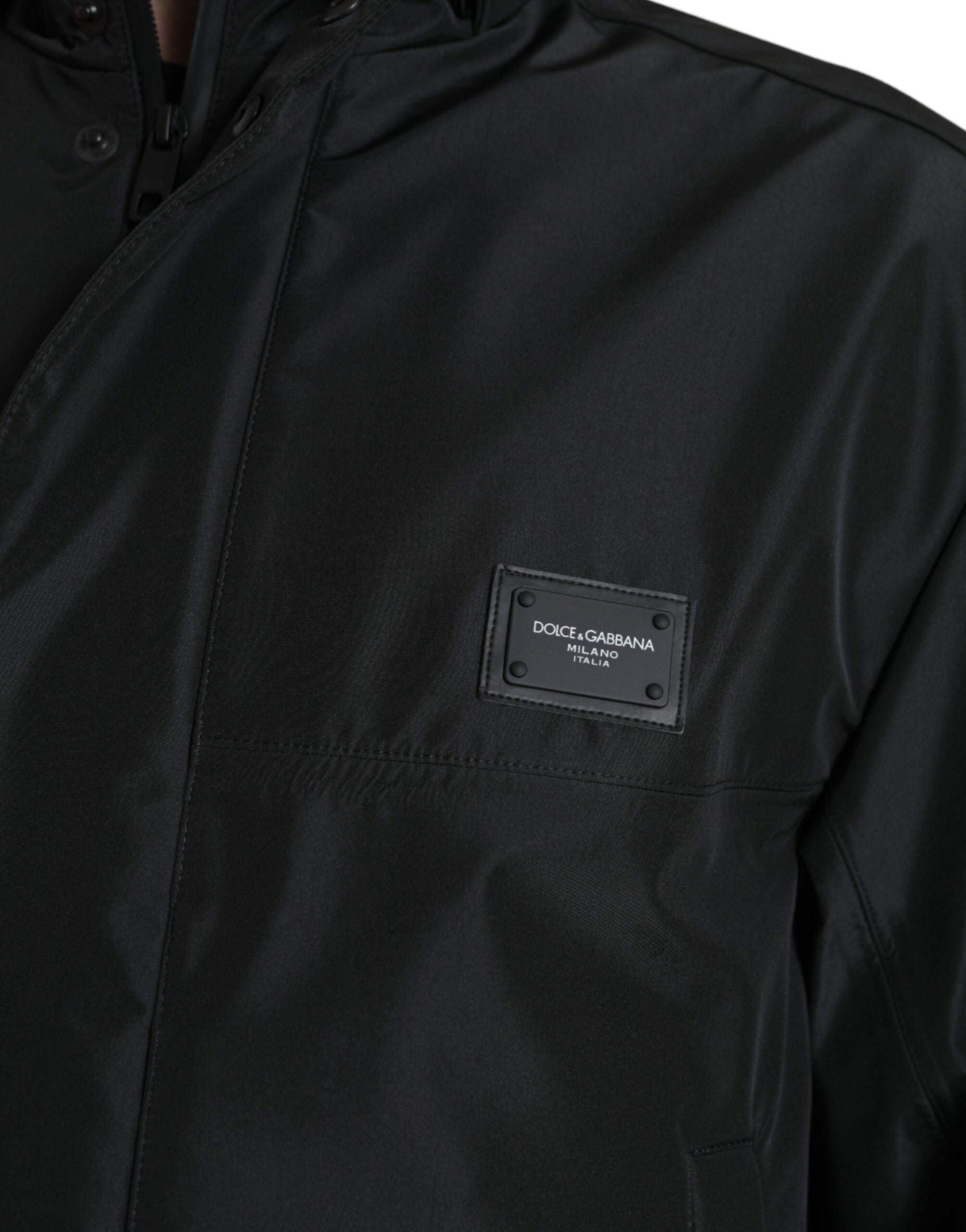 Black polyester hooded jacket with Dolce & Gabbana logo plaque, featuring a stylish hood and modern design.