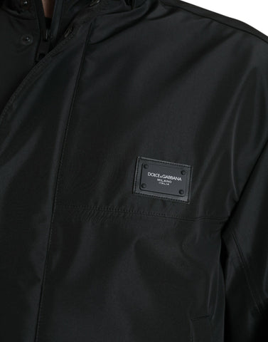 Black polyester hooded jacket with Dolce & Gabbana logo plaque, featuring a stylish hood and modern design.