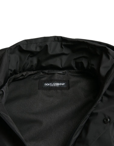 Black polyester hooded jacket with Dolce & Gabbana logo plaque, casual outerwear with front zipper and hood detail.
