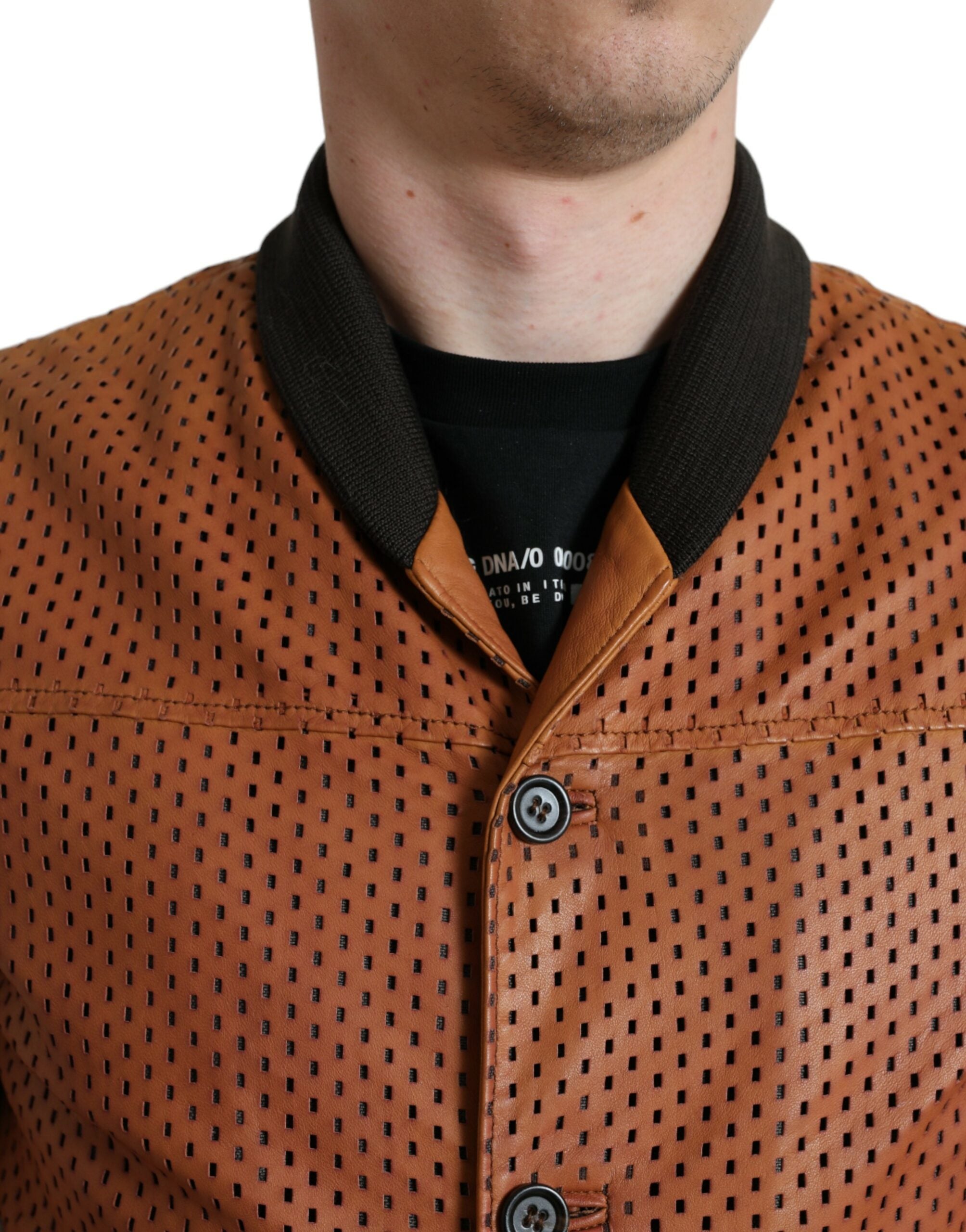 Brown lambskin leather perforated jacket by Dolce & Gabbana, featuring a stylish design and textured surface.
