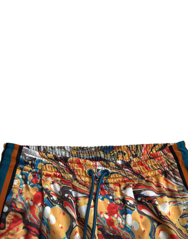 Multicolor marble print satin pants by Dolce & Gabbana showing a stylish, flowy design with vibrant marble patterns.