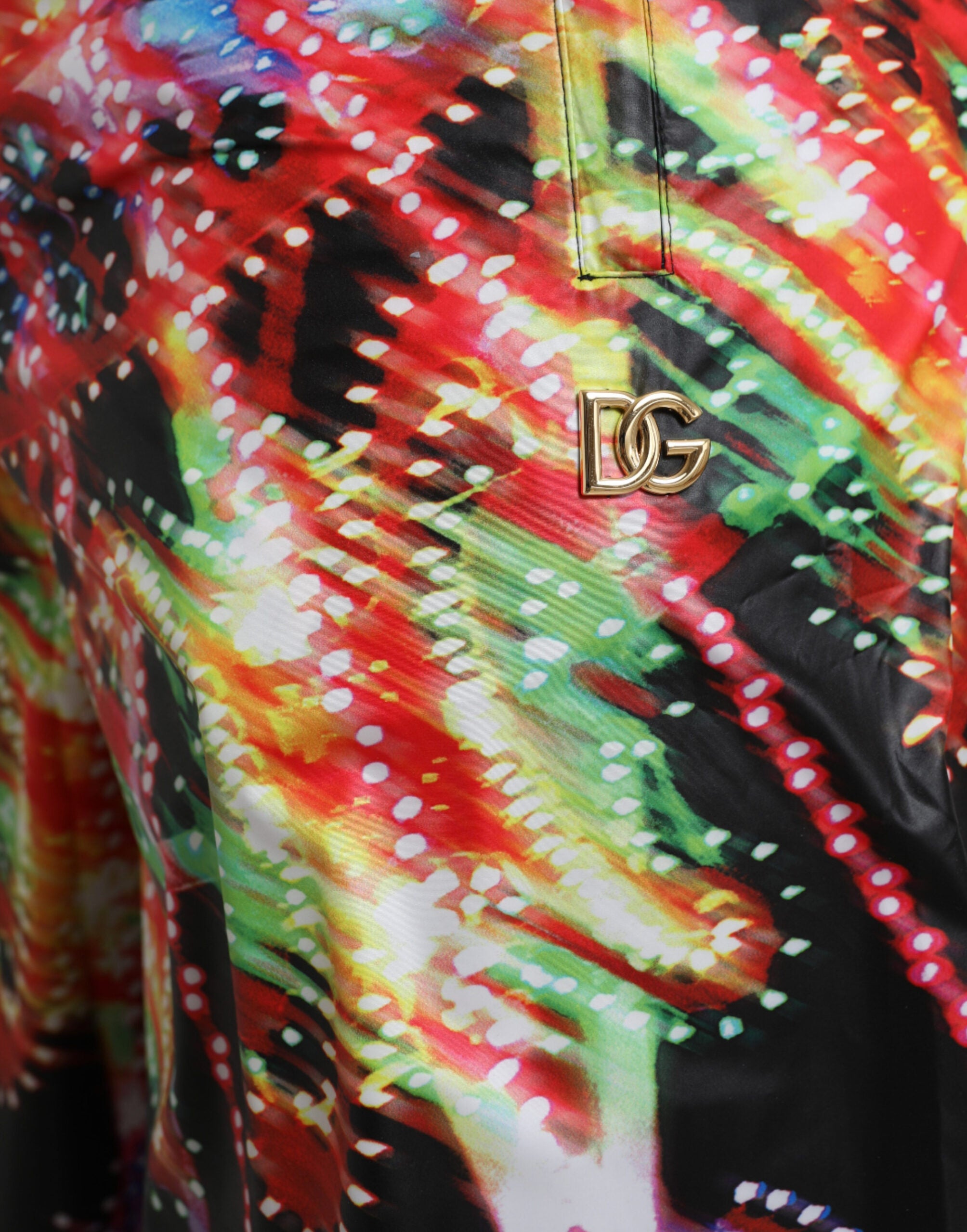 Multicolor Luminarie print Dolce & Gabbana men's Bermuda shorts with vibrant pattern and tailored fit, displayed on a neutral background.