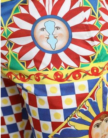 Multicolor Carretto print men’s Bermuda shorts by Dolce & Gabbana, featuring vibrant geometric patterns and casual fit.