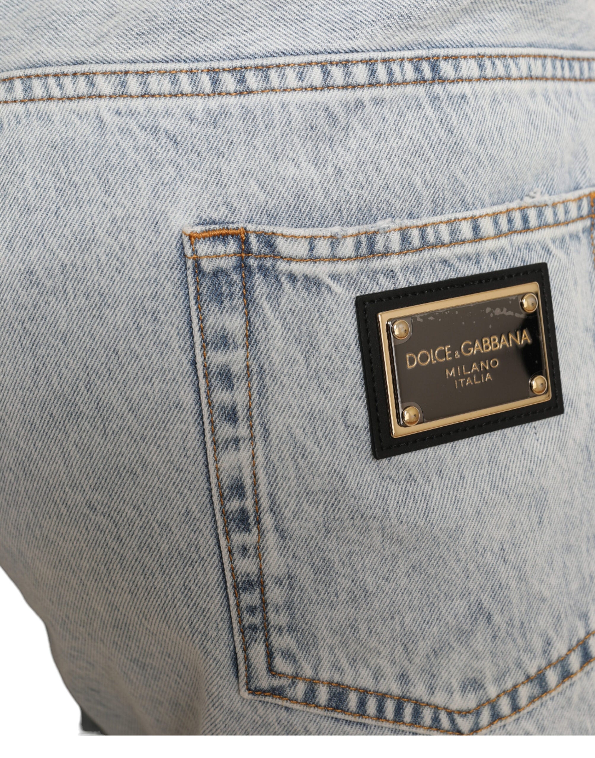 Multicolor floral print denim Bermuda shorts by Dolce & Gabbana, showing vibrant floral patterns and classic denim fabric.
