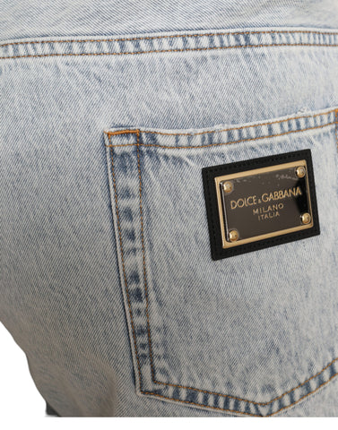 Multicolor floral print denim Bermuda shorts by Dolce & Gabbana, showing vibrant floral patterns and classic denim fabric.