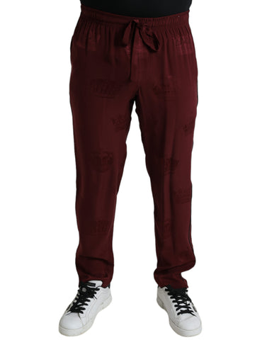 Maroon silk pajama pants with crown pattern from Dolce & Gabbana, featuring a relaxed fit and elegant design.