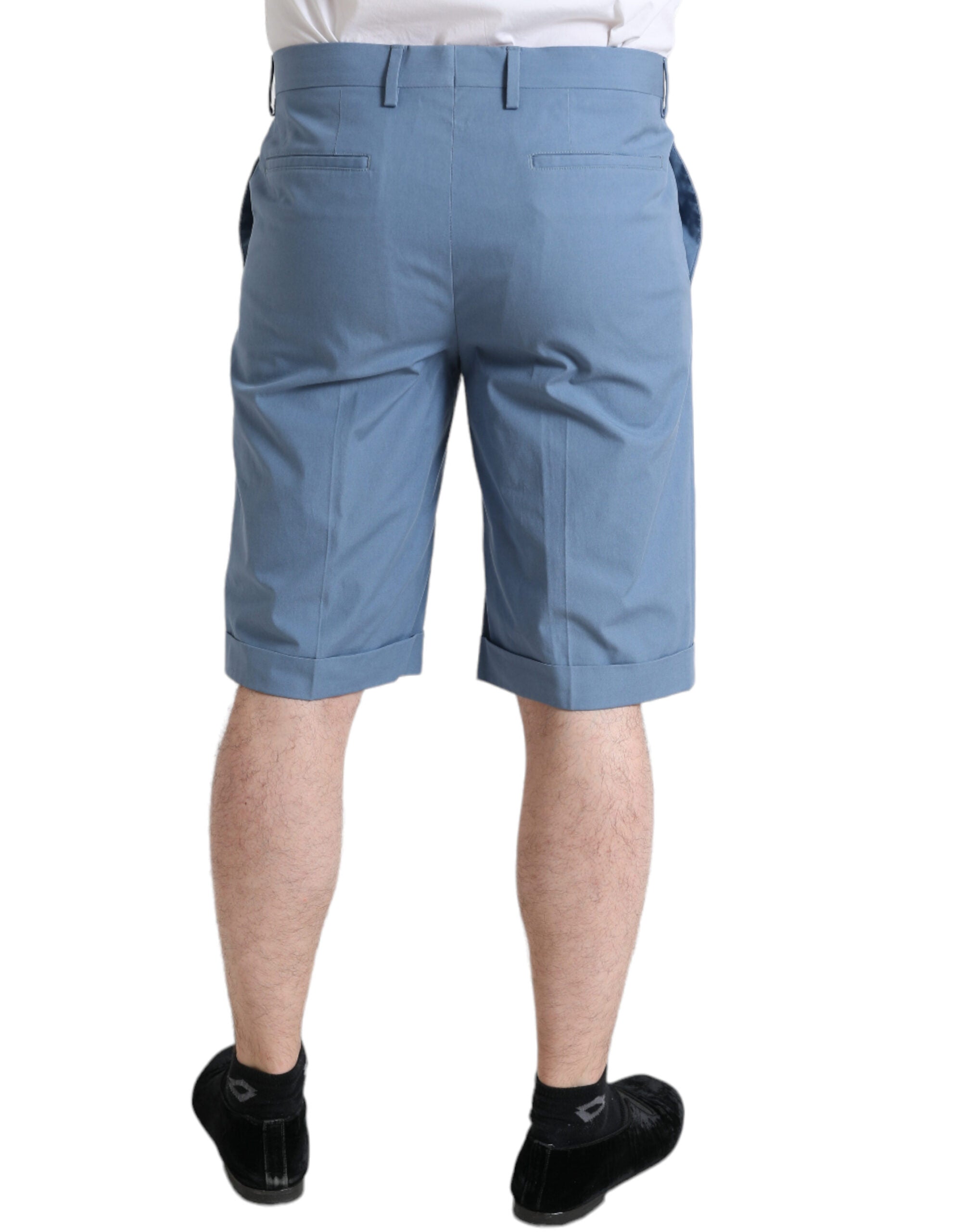 Sky blue cotton men's Bermuda shorts with folded hem by Dolce & Gabbana, shown folded neatly on a plain background.