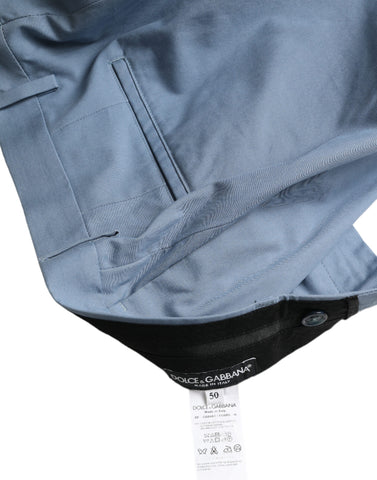 Sky blue cotton men's Bermuda shorts with folded hem by Dolce & Gabbana, displayed folded on a neutral background.