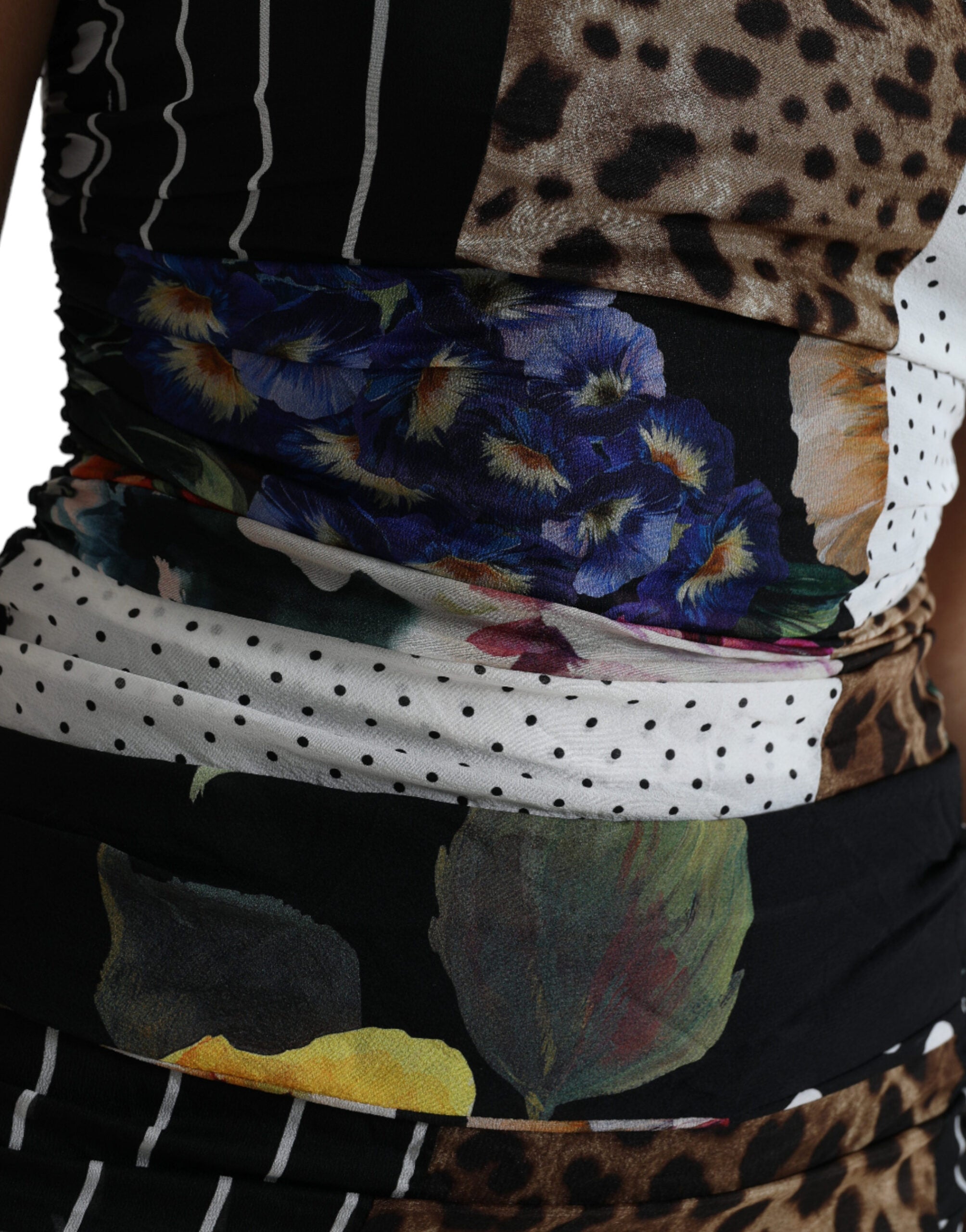 Multicolor patchwork floral and leopard print midi bodycon dress by Dolce & Gabbana, showcasing vibrant fabric and fitted silhouette.